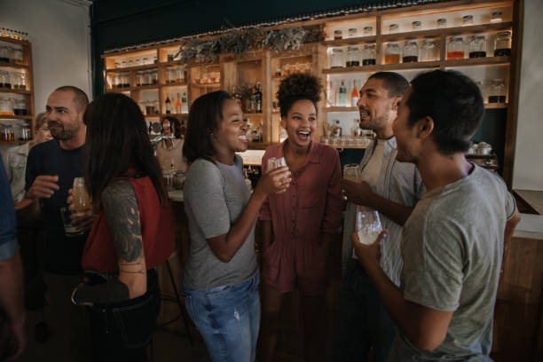 istock Diverse young friends enjoying an evening in a pub together 2193893139