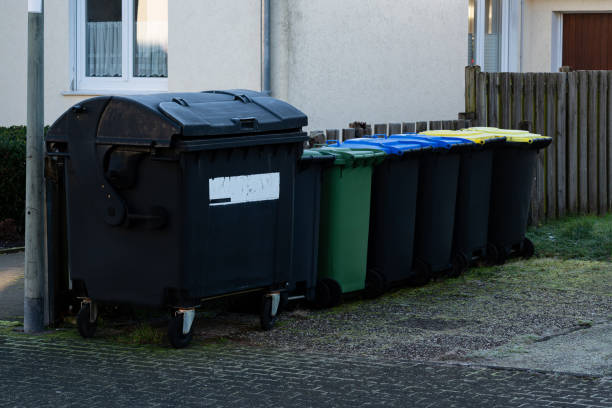 istock Various waste bins lined up on a street in a residential area 2193893846