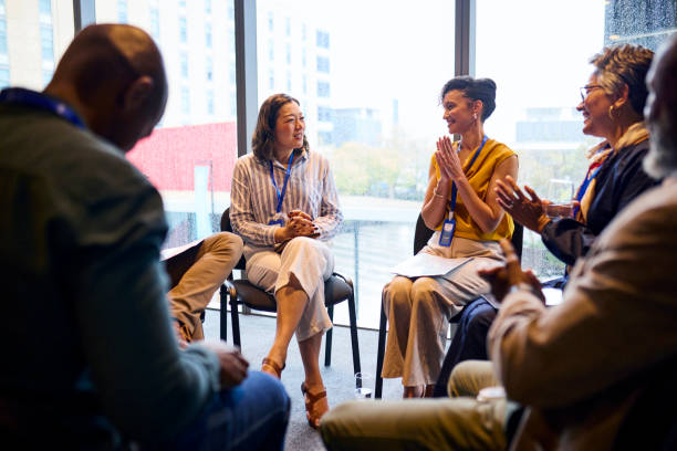 istock Engaged Team Meeting in a Circle 2193895843