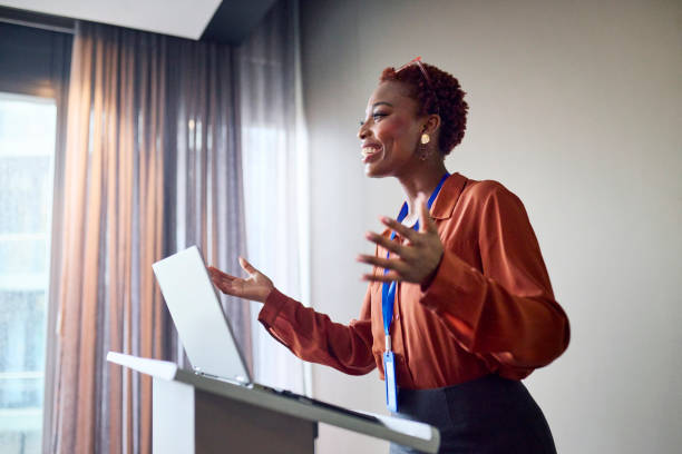 istock Dynamic Presentation: Engaging Speaker at Podium 2193895858