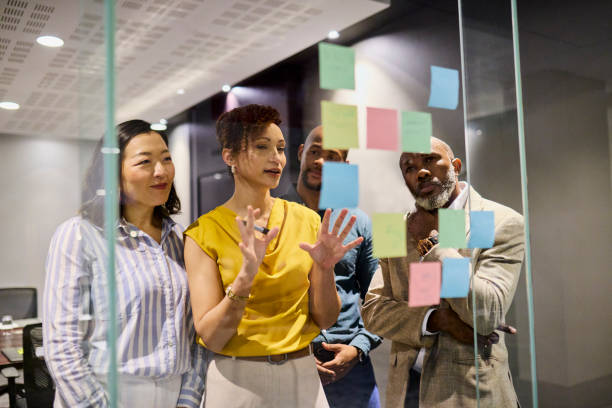 istock Diverse Team Brainstorming on Glass Board 2193896306