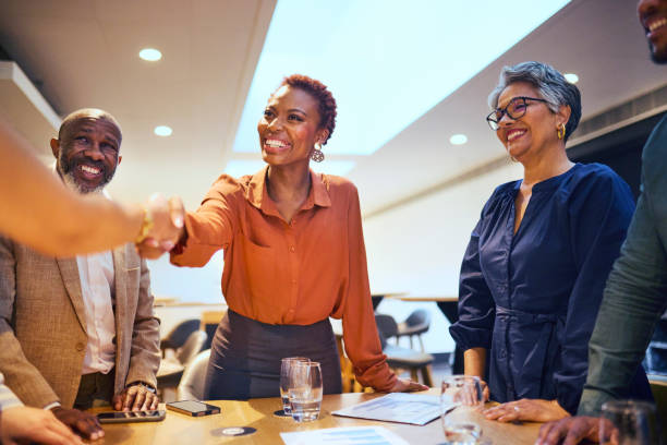 istock Successful Business Handshake and Team Meeting 2193896439