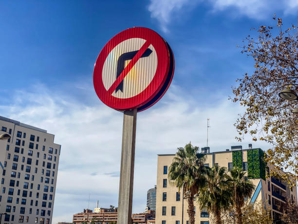 Low angle view of a no turn sign in residential district in the city of Valencia, Spain