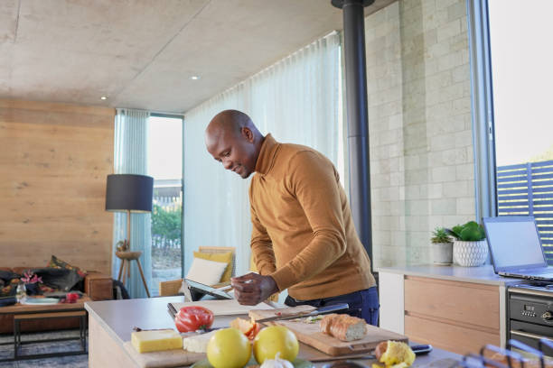istock Man preparing food in kitchen 2193897454