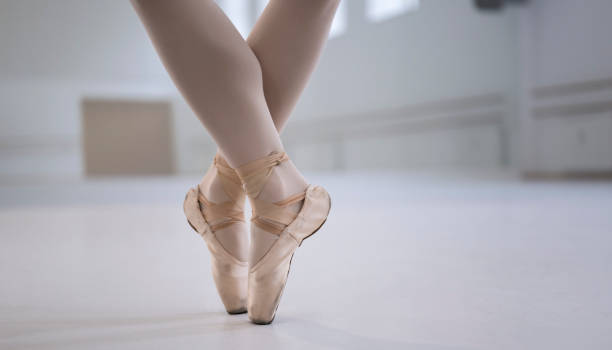istock Ballerina Standing On Toes In Pointe Shoes 2193900562