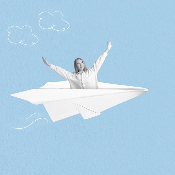 istock Happy woman in paper airplane 2193901944