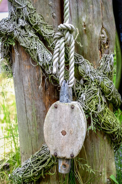Old rusty ship pulley or winch for maritime decoration in the garden