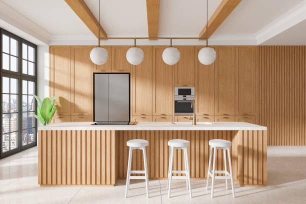istock Modern kitchen interior with wooden cabinets, island, and white stools in a luxury home design, next to large windows and indoor plant. 3D Rendering 2193904257