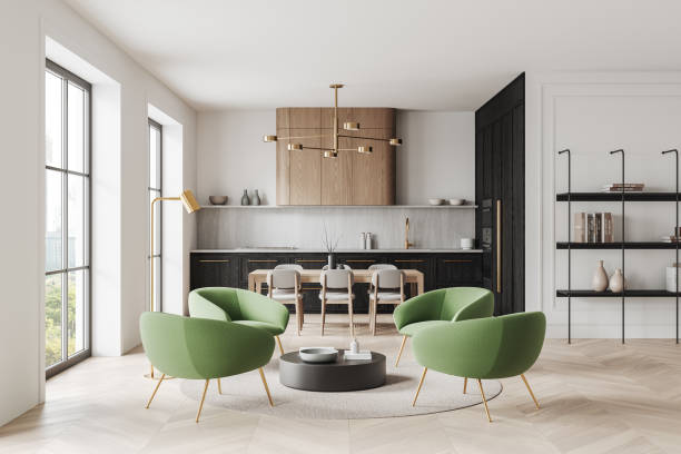 istock Modern living room with green chairs, elegant kitchen and dining area, bright windows, and stylish decor. 3D Rendering 2193905447