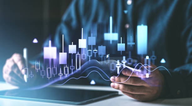 istock Financial trader analyzing stock market candlestick chart with futuristic interface. 2193905472