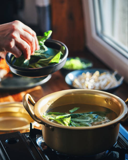 istock Preparing Bibimbap Korean Rice Dish in Domestic Kitchen 2193907449