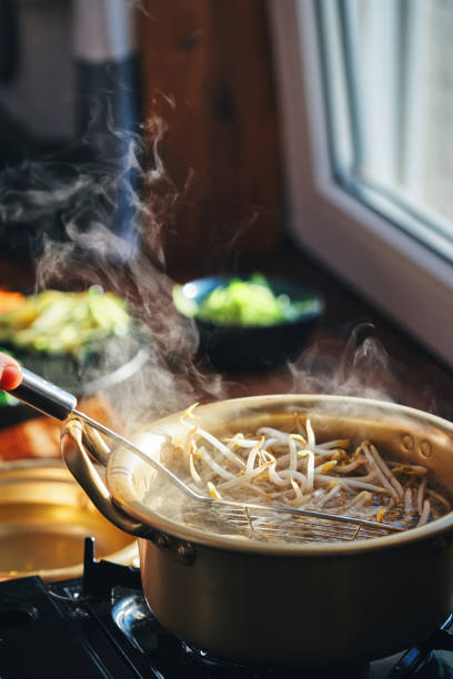 istock Preparing Bibimbap Korean Rice Dish in Domestic Kitchen 2193907461