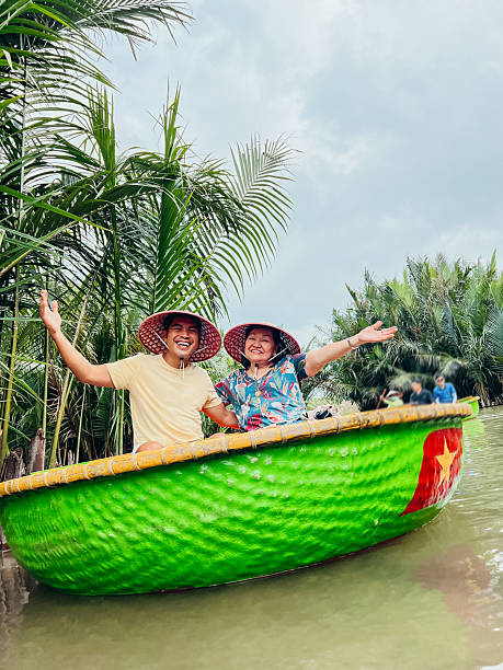 istock Smiling Couple in Traditional Vietnamese Basket Boat 2193909155