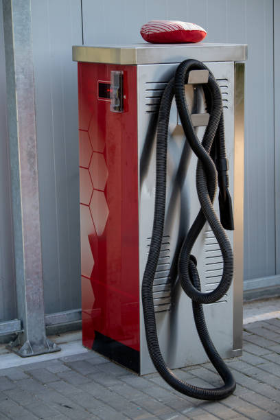 istock Red and Silver Vacuum Cleaner Station with Coiled Black Hose 2193909378
