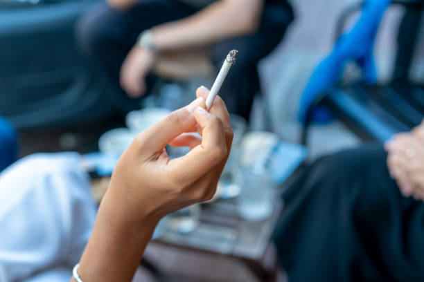 istock Young woman enjoying a cigarette 2193910786