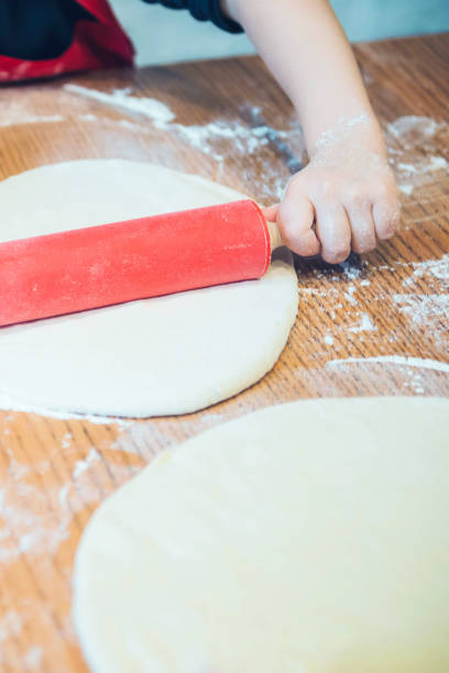 istock Children participate cooking master class. Culinary courses for children. Cooking pizza. 2193910995
