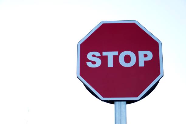 istock stop road sign with white background and copy space 2193911504