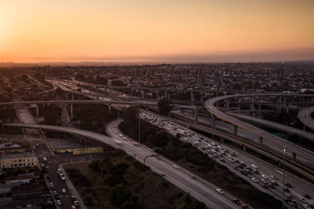 istock 105-110 Interchange in Los Angeles, CA at Sunset in Fall - Aerial 2193912365