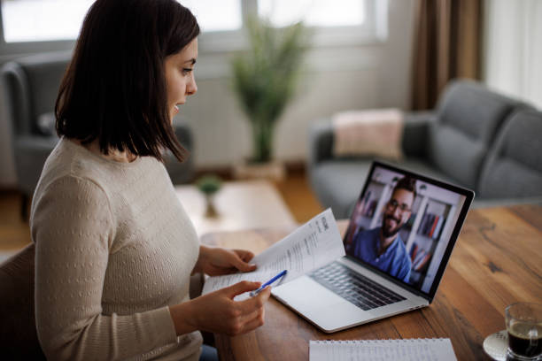 istock Woman reviewing a resume during a virtual job interview 2193912869