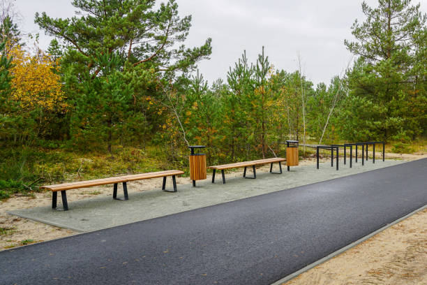 istock Contemporary ecological seaside environmental development, bike path, wooden benches, trash can 2193912877
