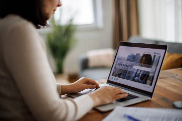 istock Woman navigating through an online job search platform on her laptop 2193912928