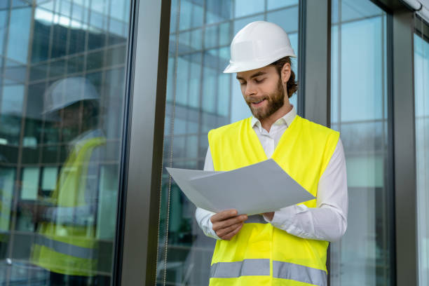 istock Young male engineer scrutinizing new project scheme and looking determined 2193913476