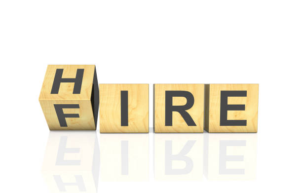 istock Fliping wooden cubes with word hire to fire 2193913898