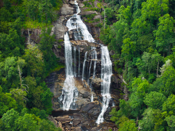 istock Whitewater Falls with falling down clear water from rocky boulders between green lush woods in Nantahala National Forest, North Carolina, USA 2193914726