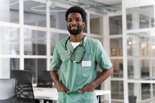 istock Smiling man professional therapist physician posing at work in clinic 2193916030