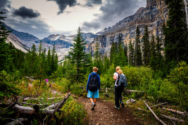 istock two people hiking in the mountains of Alberta in Canada 2193917954