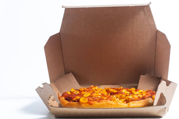 istock Freshly baked corn topping pizza in an open cardboard box on a white background 2193918552