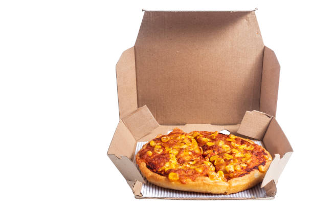 istock Delicious cheese and corn pizza in open cardboard box on a white background, closeup 2193918567