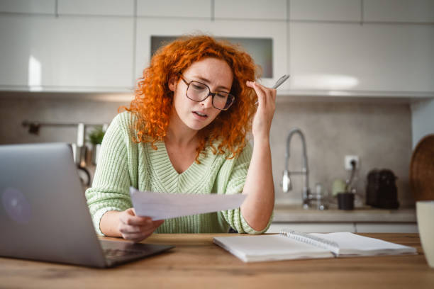istock adult exhausted woman work from home on laptop and notebook 2193924941