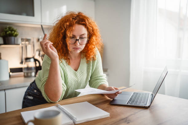istock adult exhausted woman work from home on laptop and notebook 2193925043