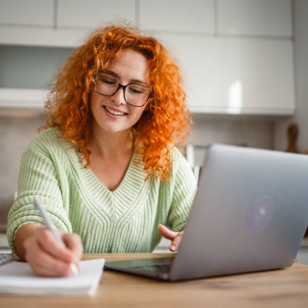 istock adult woman work from home on laptop and notebook 2193926189