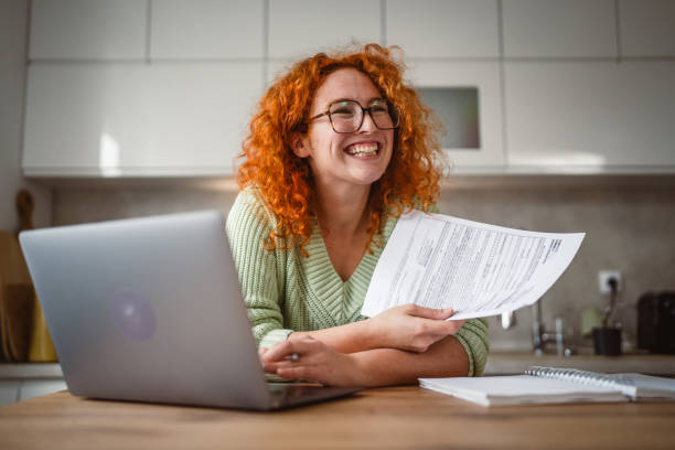 istock adult woman work from home on laptop and notebook 2193926250