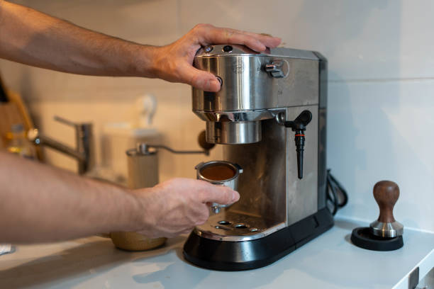 istock Man brews coffee at home 2193926689