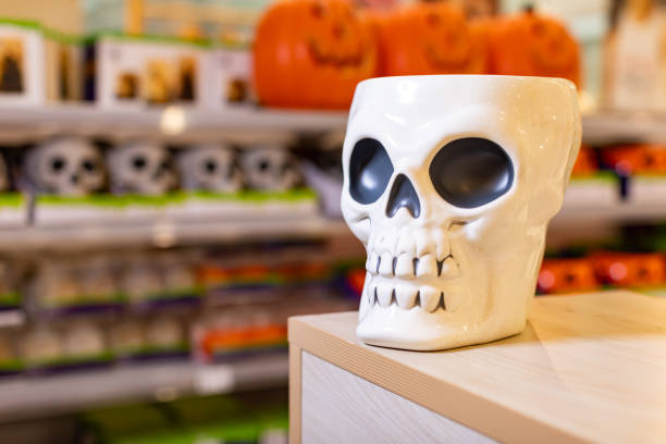 A collection of halloween decorations are seen on display in a retail store.