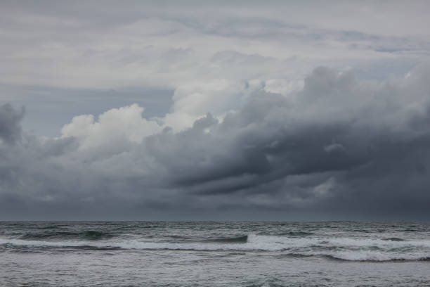 istock stormy waves crashing on the sea with a dark sky background 2193929518