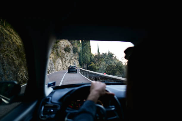 istock mountain road driving car. 2193933614