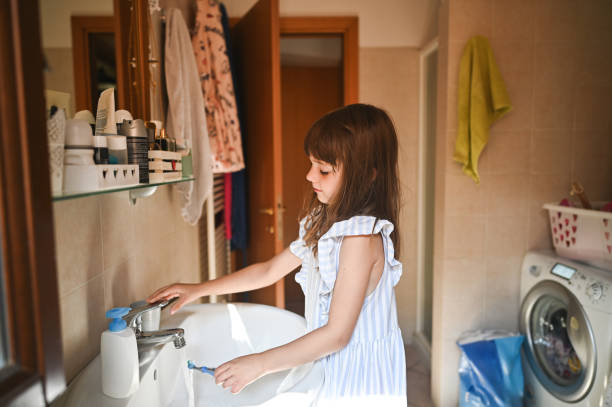 istock brushing teeth at domestic bathroom. 2193935221