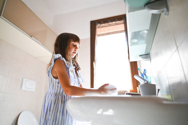 istock low angle view of Playful child playing with soap. 2193936344