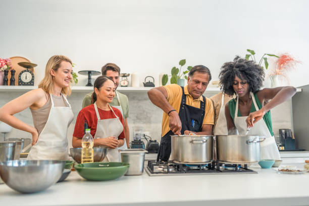 istock Joyful Cooking Session with Indian Chef and Diverse Students 2193939482
