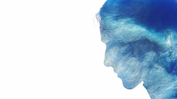 Aura silhouette. Soul healing. Blue mist cloud double exposure profile face of tranquil mindful woman isolated on white empty space background.