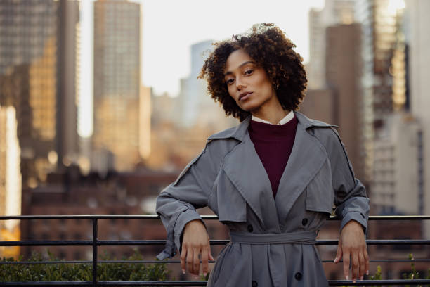 istock Confident Individual in Urban Setting with Stylish Attire at Sunset 2193941019