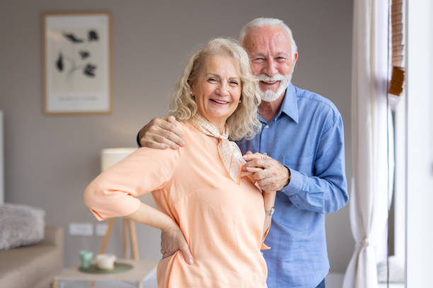 istock Elderly couple smiling together in a cozy setting 2193941125