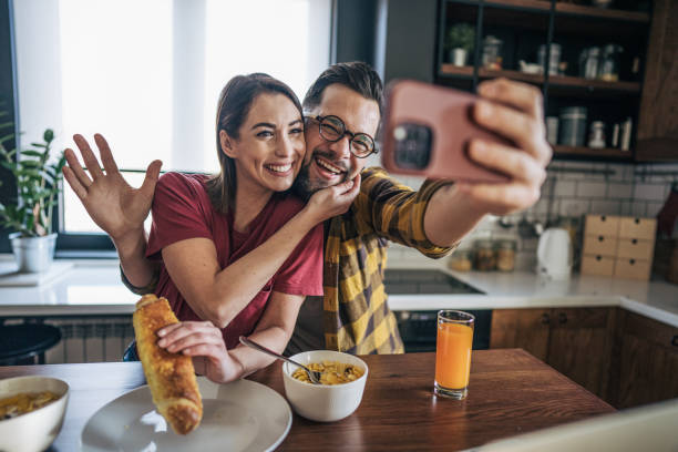 istock A man and a woman take selfie in the kitchen. 2193941615