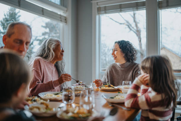 Multi-generation family having holiday dinner at home