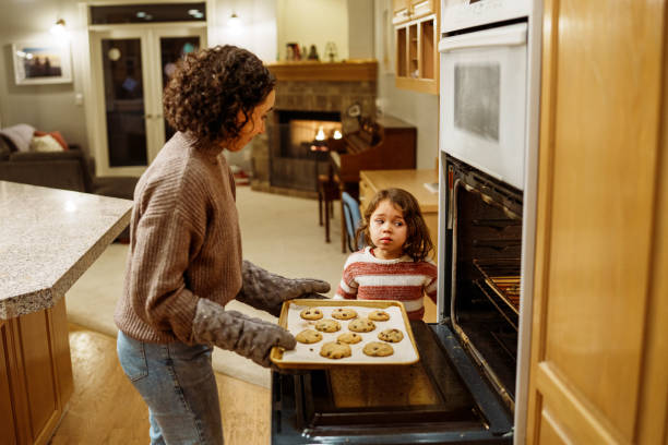 Mom and daughter baking cookies