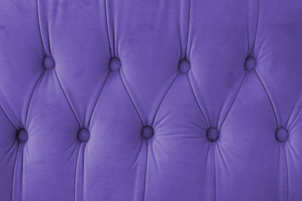 istock Capitone, Chesterfield style suede fabric texture, purple diamond buttoned purple background 2193942870
